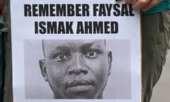 An image of Faysal Ishak Ahmed on a poster at a vigil outside the inquest into his death