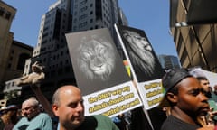 South Africa CoP17<br>epa05554090 Animal rights activists carry placards during an anti canned lion protest at the Sandton Convention Centre during the first day of the CoP17 Cites Conference, Johannesburg, South Africa, 24 September 2016. Around 3500 delegates have converged on Sandton to discuss topics ranging from poaching, the trade in rhino and elephant horn. EPA/KIM LUDBROOK