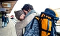 Smiling young couple embracing on station platform