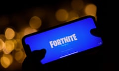 FILES-US-CHINA-GAMING-TECHNOLOGY-CENSORSHIP<br>(FILES) This file illustration picture taken on August 14, 2020 shows a person logging into Epic Games' Fortnite on their smartphone in Los Angeles. - Chinese users confirmed on November 15, 2021 that they could no longer access the popular survival game Fortnite amid a crackdown by authorities on titles featuring excessive violence. (Photo by Chris DELMAS / AFP) (Photo by CHRIS DELMAS/AFP via Getty Images)