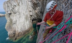 Henry sorting ropes on the face of Wen Zawn