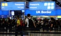 Passengers line up for passport control in the UK Border area