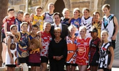 Aunty Pam Pedersen, AFL CEO Gillon McLachlan and children wearing Indigenous round jerseys during the launch of this weekend’s AFL Sir Doug Nicholls Indigenous round.