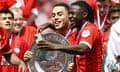 Sergiño Dest (left) celebrates PSV Eindhoven’s title with Johan Bakayoko. 