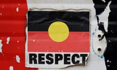 A sticker of the Australian Aboriginal Flag along with the word "RESPECT" is pictured on a structure at the Aboriginal Tent Embassy