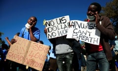 Health workers carry placards as they protest during the coronavirus disease outbreak in Harare on Monday.