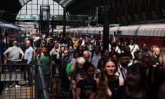 Passengers on a busy platform at King's Cross station