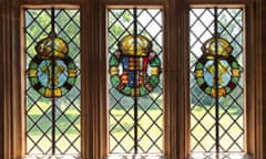 A stained glass heraldic roundel depicting the arms of Henry VIII and Ann Boleyn on the window linked to Nonsuch palace.