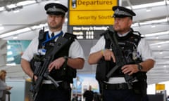 Armed police patrol at Terminal 5, Heathrow Airport in London, March 2016