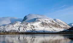 Ben Nevis covered in snow seen on a clear day