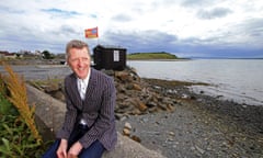 Glenn Patterson sits near the Kircubbin Car Wash on the Portaferry Road, County Down, Northern Ireland.