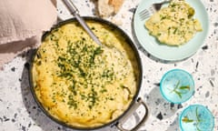 Topview of a crustless vegetable pie topped with a cheesy potato mash and sprinkled with tarragon.