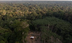 wood huts on cleared land in the middle of forest in Caroebe, Roraima