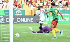 Mohamed Bayo slots the ball past Cameroon keeper Fabrice Ondoa for the opening goal