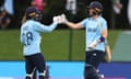 England's Danni Wyatt and Heather Knight celebrate beating Pakistan in their World Cup math at Hagley Oval on 24 March in Christchurch.