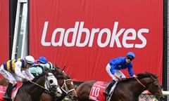 Ladbroke sign at horse race finish line