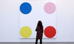 Press View Of The Latest Damien Hirst Exhibition At The Gagosian Gallery<br>LONDON, ENGLAND - JANUARY 12: An employee looks at the artwork “4-Chlorephenol, 2008”, part of the artist Damien Hirst’s exhibition “The Complete Spot Paintings” at the Gagosian Gallery on January 12, 2012 in London, England. The exhibition is taking place in eleven locations across the world, with more than 300 paintings created by the artist lent to the Gargosian gallery by private individuals and public insititutions. (Photo by Matthew Lloyd/Getty Images)