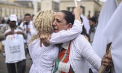 Women hug during a rally in support of the Colombian peace process with Farc. 