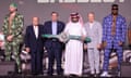 Tyson Fury and Francis Ngannou pose for a photo alongside promoter Bob Arum, World Boxing Council president Mauricio Sulaiman, General Entertainment Authority chairman Turki Al-Sheikh and promoter Frank Warren.