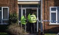 Police officers at the property in Kettering, Northamptonshire where Saju Chelavalel murdered his wife and two children in December 2022.