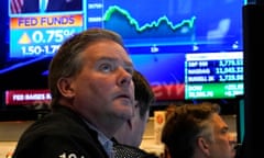 Traders work on the floor of the New York Stock Exchange as the US Federal Reserve announces a hike in interest rates. 