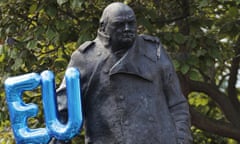 An EU balloon flies next to a statue of literature laureate Winston Churchill in Parliament Square, London.
