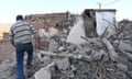 A man walks in the rubble of a damaged building after a 6.8-magnitude earthquake in Tahannaout, Morocco.