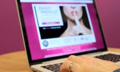 A man wearing a wedding ring looks at the Ashley Madison website.