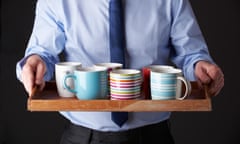 Person carrying tray of tea