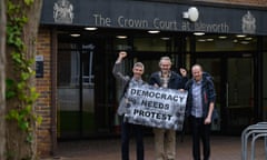 Roger Hallam, Dr. Larch Maxey and Mike Lynch-White pose for photographs as they leave Isleworth Crown Court