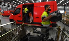 An employee is seen at work at Australia Post parcel sorting facility
