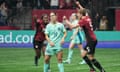 Quinn celebrates scoring for Canada as Katrina Gorry looks dejected