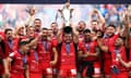 Toulouse’s Antoine Dupont lifts the Champions Cup trophy at Tottenham.