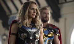 This image released by Marvel Studios shows Natalie Portman, left, and Chris Hemsworth in a scene from "Thor: Love and Thunder." (Jasin Boland/Marvel Studios-Disney via AP)
