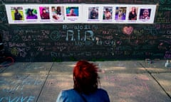 A person visits a makeshift memorial near the scene of the shooting at a supermarket in Buffalo, New York, in May 2022. 