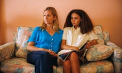 two women sitting on a sofa