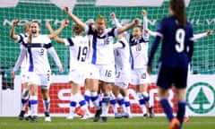 Finland players including Anna Westerlund (centre, No 16) celebrate their late winner against Scotland in qualifying.