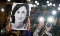 Protesters hold picture of Daphne Caruana Galizia