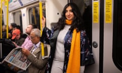 Coco on the tube in cashmere and a kimono.