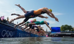 Athletes compete in the swimming stage in the Seine during the men's individual triathlon at the Paris 2024 Olympic Games
