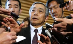 Bank of Japan governor Haruhiko Kuroda (C) speaks to reporters