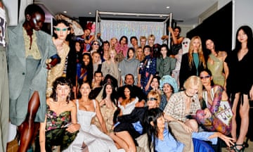 Andreas Kronthaler and models pose backstage after the Vivienne Westwood SS24 show at Paris Fashion Week