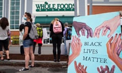Whole Foods employees walk out in protest over face mask slogans<br>epa08519133 Protesters gather outside of a Whole Foods Marketplace in support of employees that were sent home from work for wearing face masks that read ‘Black Lives Matter’, in Cambridge, Massachusetts, USA, 30 June 2020. Employees were told by management that the masks did not comply with the company dress code and were asked to wear other masks or leave work. A group of employees released a statement that demanded that Whole Foods ‘to join the anti-racist, Black Lives Matter movement’. EPA/CJ GUNTHER