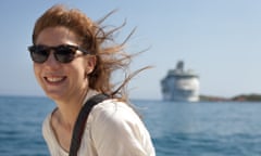 Kim on a small motorboat looking at the cruiseships docking in Labadee, a fenced-off beach in Haiti that locals called “tourist prison”