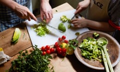 Hands chopping salad