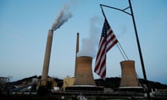 FILE PHOTO: The U.S. flag flies on Campbell Transportation's towboat M.K. McNally as it passes Mitchell Power Plant on the Ohio River in Moundsville<br>FILE PHOTO: The U.S. flag flies on Campbell Transportation's towboat M.K. McNally as it passes Mitchell Power Plant, a coal-fired power-plant operated by American Electric Power (AEP), on the Ohio River in Moundsville, West Virginia, U.S., September 10, 2017. REUTERS/Brian Snyder/File Photo