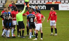 Morecambe defender Yann Songo’o is sent off against Tranmere at Saturday.