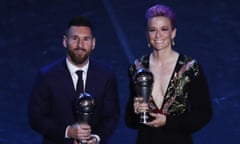 Lionel Messi and Megan Rapinoe pose with their awards.