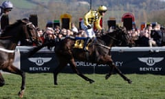 Cheltenham National Hunt Racing Festival 2020 day four<br>Paul Townend crosses the finishing line on Al Boum Photo to beat Santini (left) and win the Gold Cup for the 2nd consecutive year during day four of the Cheltenham National Hunt Racing Festival at Cheltenham Racecourse on March 13th 2020 in Gloucestershire (Photo by Tom Jenkins)