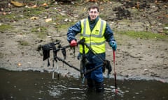 A volunteer helping clean up a 1km stretch of Regents Canal near Salmon Lane Lock, London